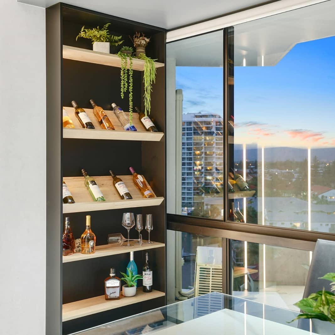 Custom wine cellar shelving with bottles and view